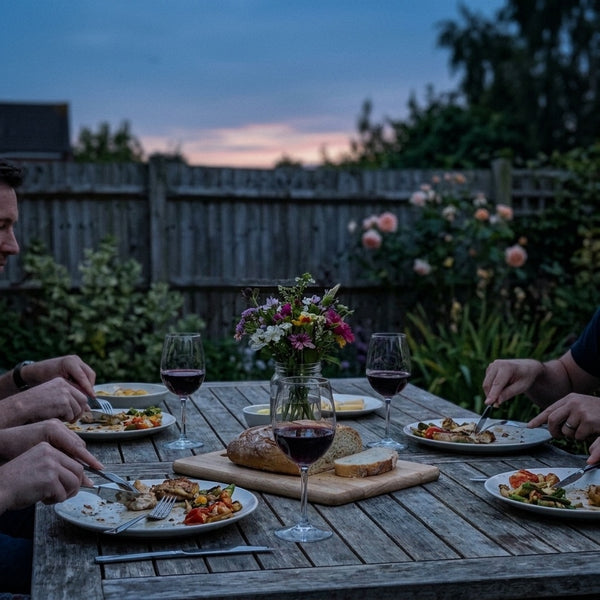 Garden dinner table at dusk in an English back garden with dim fading light, before an Eclara Ilumina cordless lamp