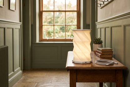 Lumina Fold lamp with its USB-C charging cable, cordless and rechargeable