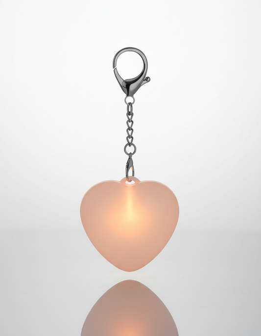 Eclara Corazon heart-shaped rechargeable handbag light, glowing white on a clean background
